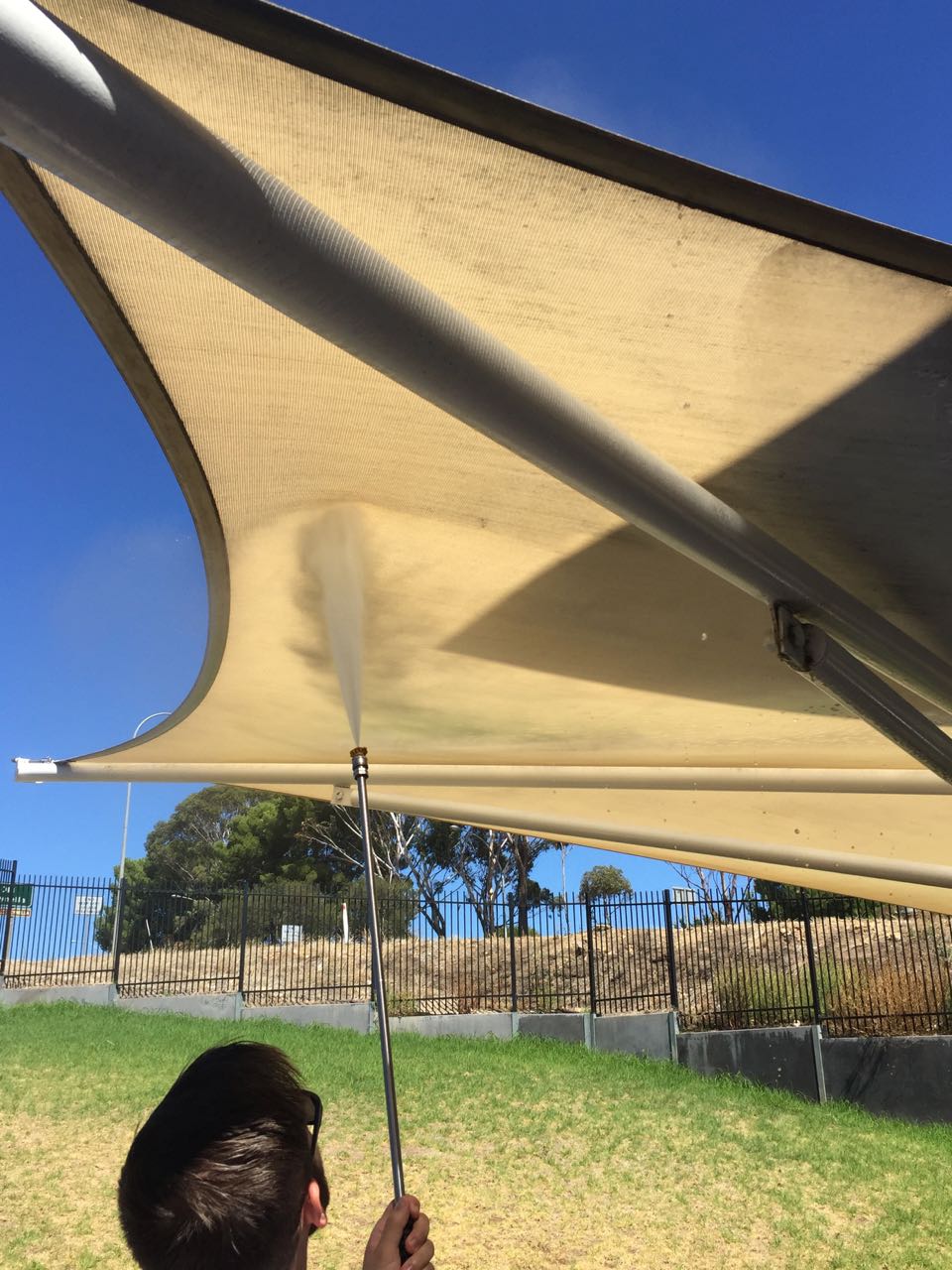 One of our qualified technicians undertaking pressure cleaning on an Adelaide client's outdoor canopy